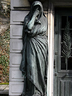 A statue from a tomb in Père Lachaise cemetery